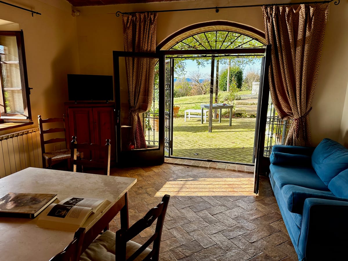 The glazed archway open onto the garden and the valley, from the living room