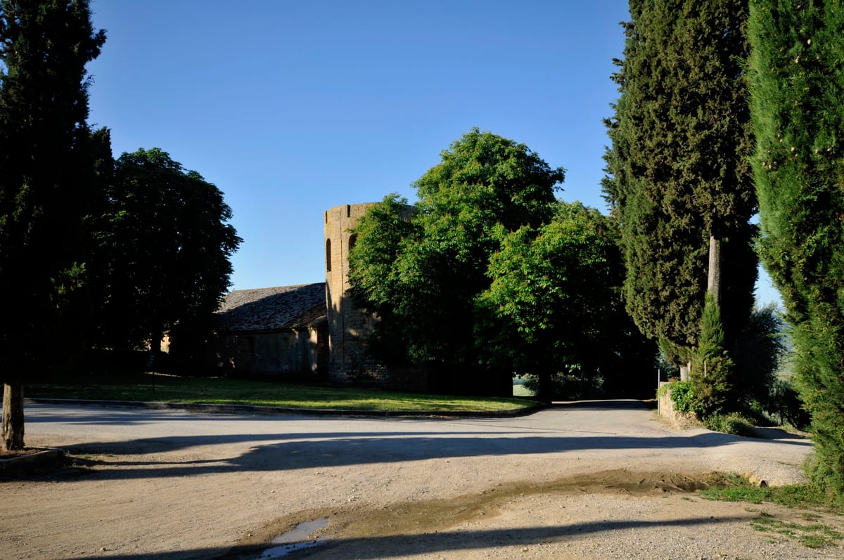 The Pieve di Corsignano and its cylindrical bell tower, 700 metres from the house